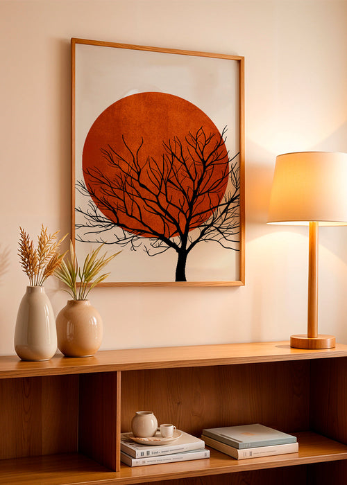 Quadro de paisagem com sol vermelho e árvore em silhueta