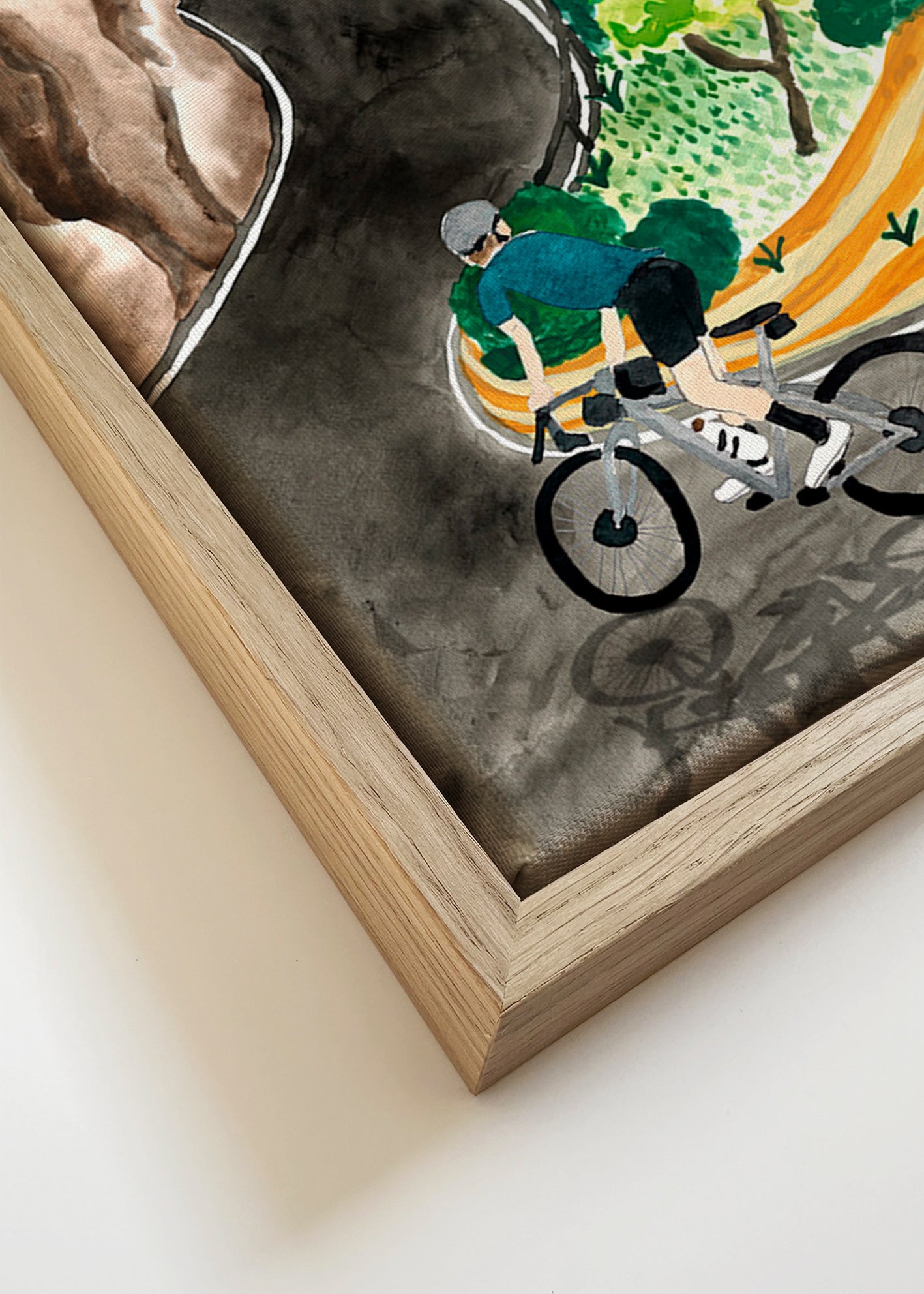Quadro de paisagem com ciclista em curva montanhosa