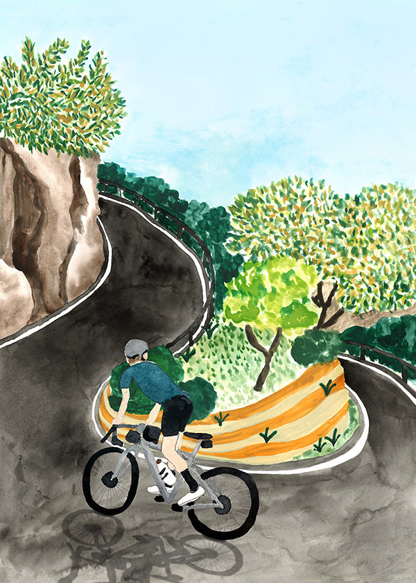 Quadro de paisagem com ciclista em curva montanhosa