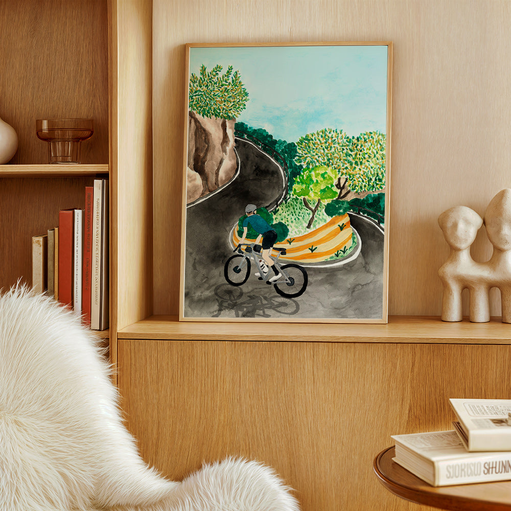 Quadro de paisagem com ciclista em curva montanhosa