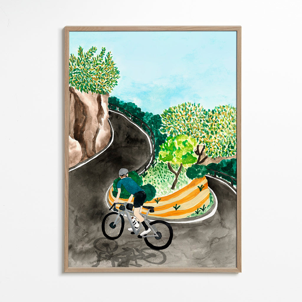 Quadro de paisagem com ciclista em curva montanhosa
