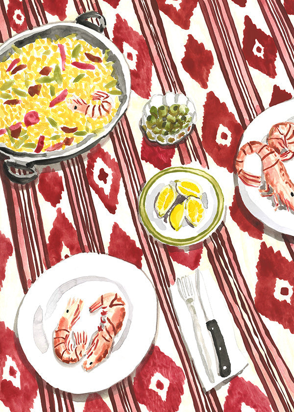 Arte para cozinha: paella e camarões sobre toalha estampada