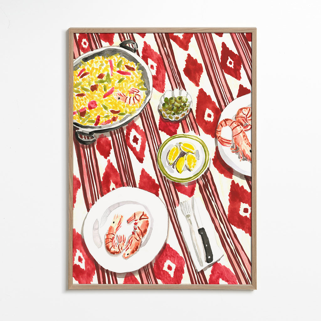Arte para cozinha: paella e camarões sobre toalha estampada