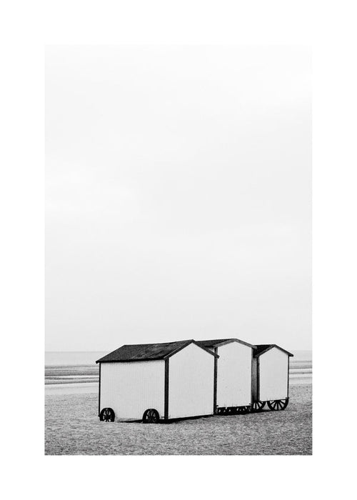 Quadro de paisagem preto e branco com cabanas de praia