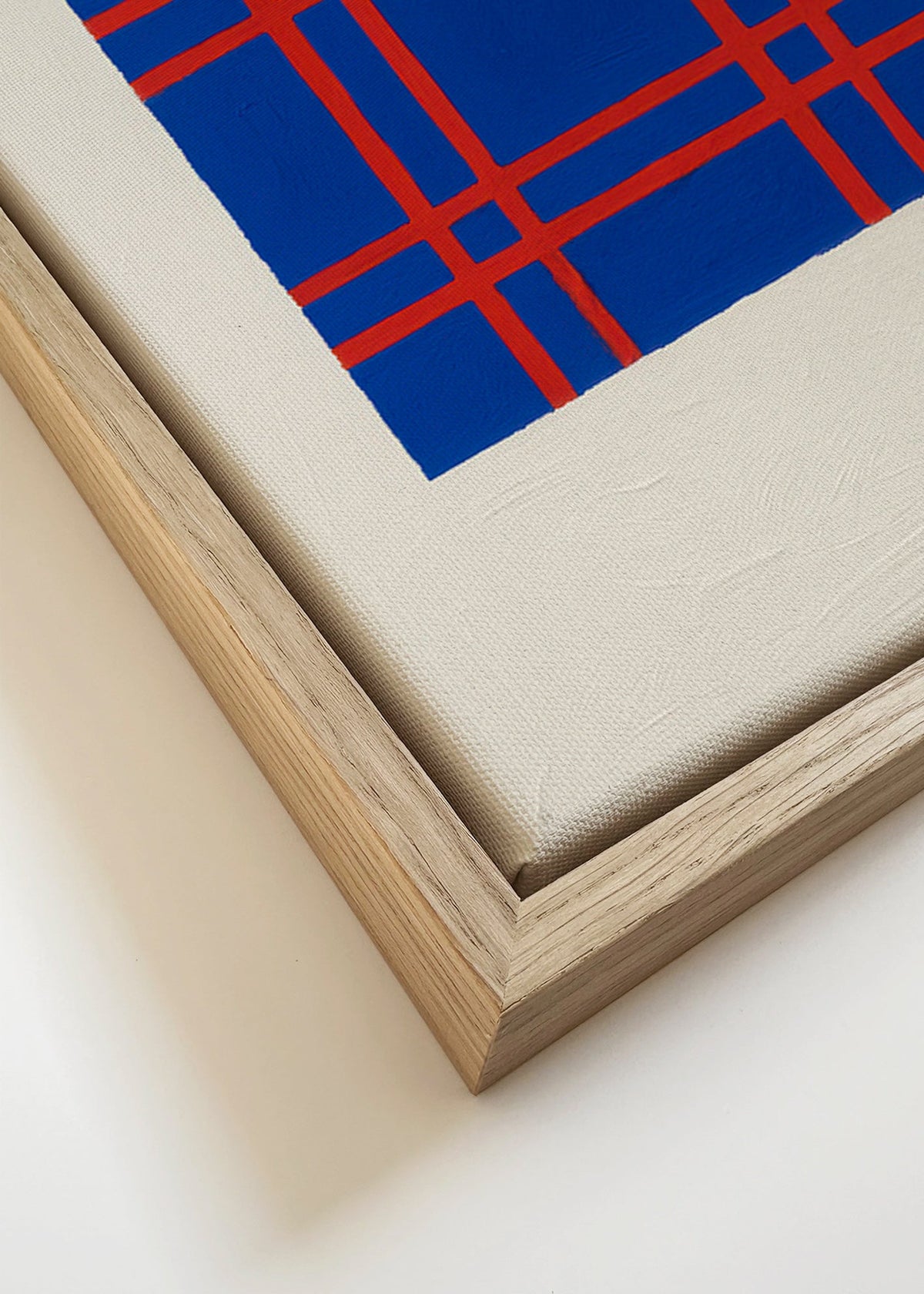 Quadro geométrico azul com trama vermelha – Canvas detail