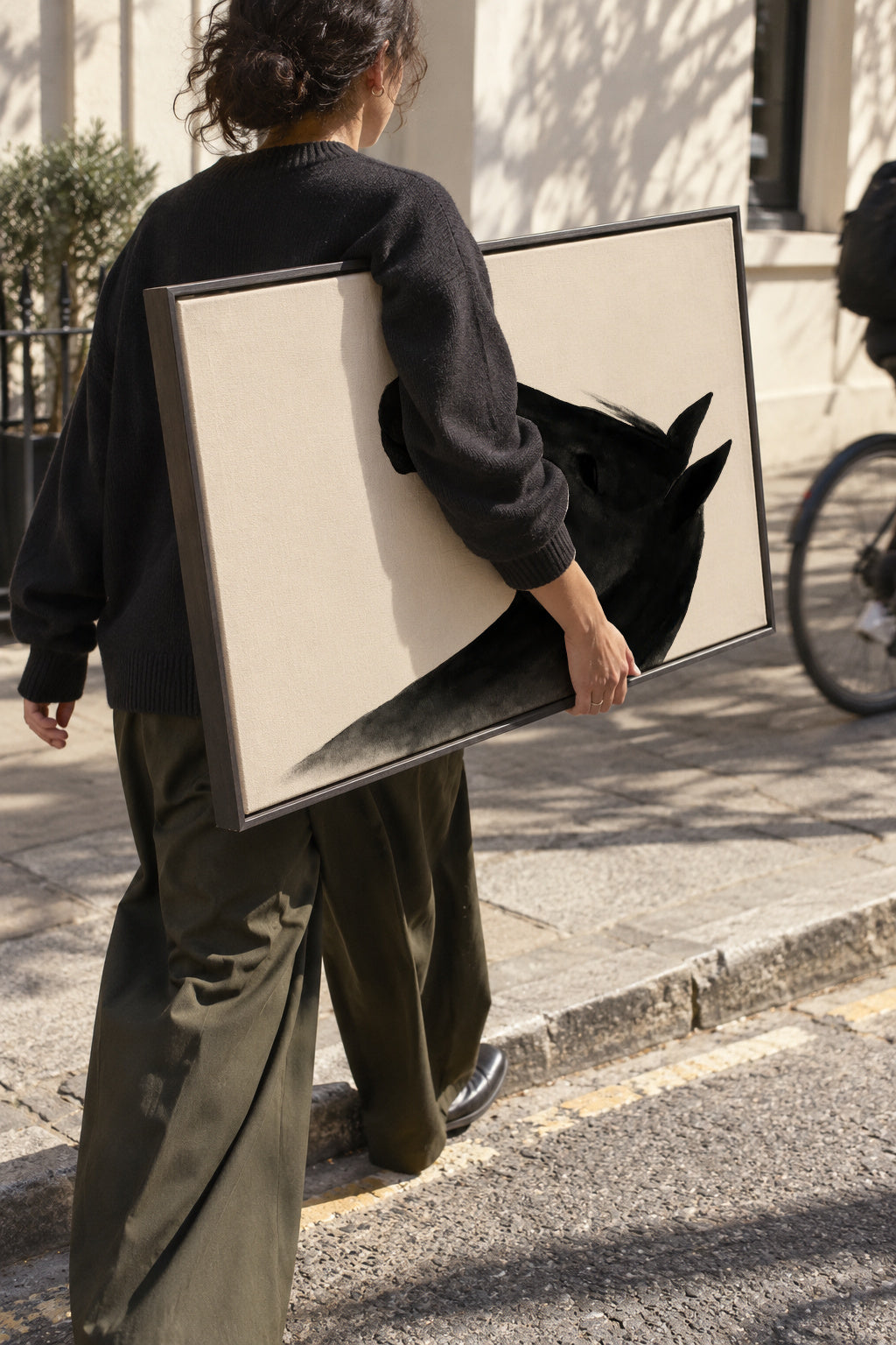 Dark Stallion - Framed canvas in an interior