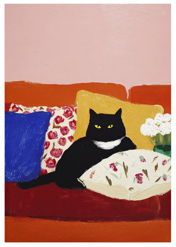 Quadro gato preto no sofá colorido