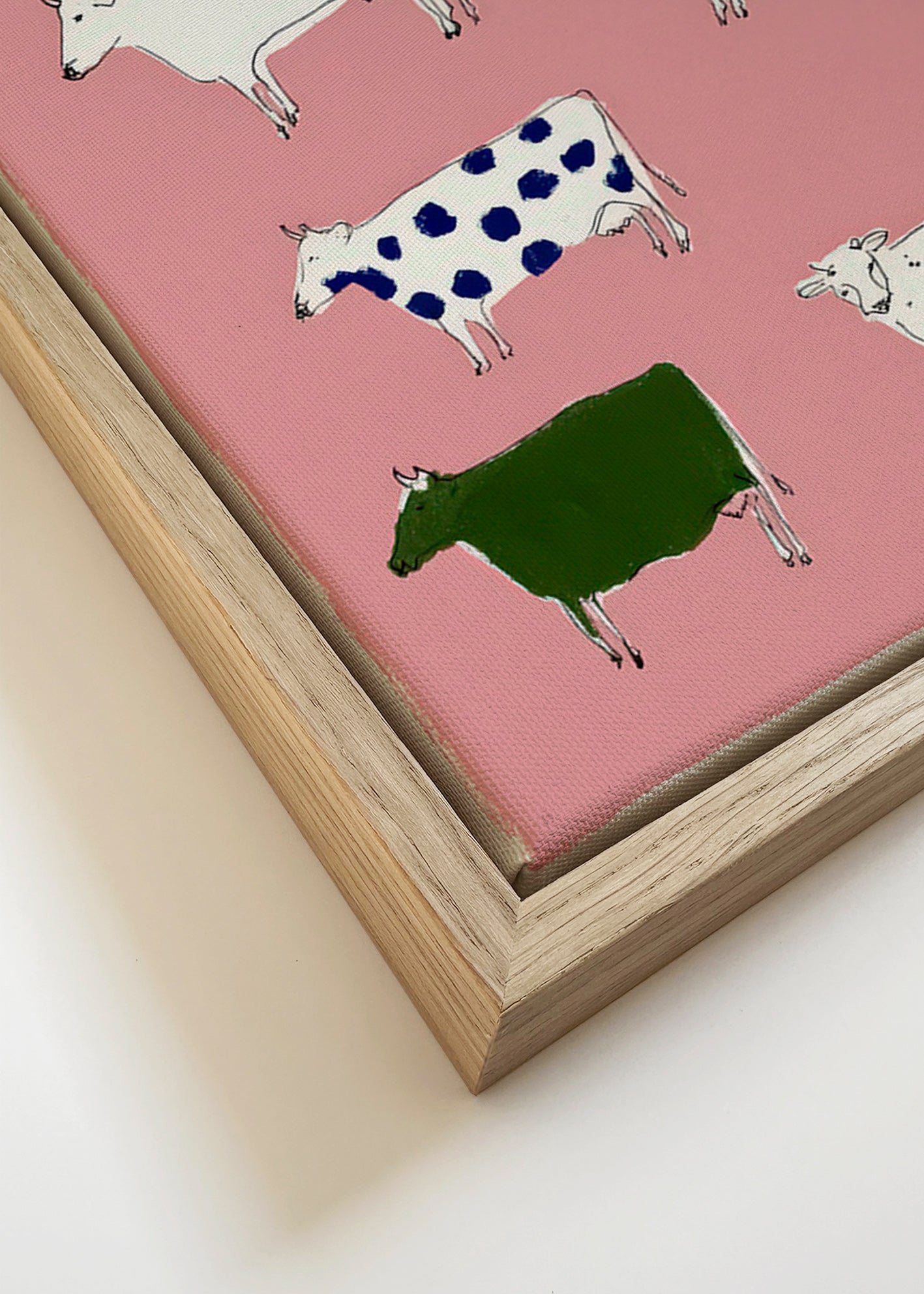 Quadro de vacas ilustradas sobre fundo rosa