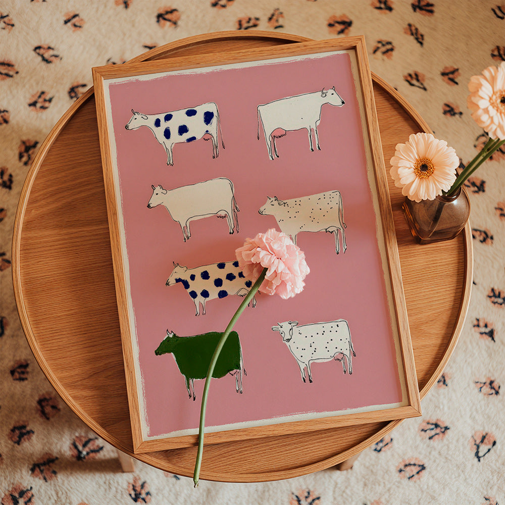 Quadro de vacas ilustradas sobre fundo rosa